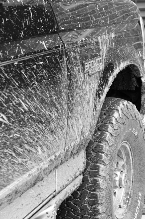 1996 Ford Bronco - This Ford Bronco has been driven through mud, covering its exterior in splatters.