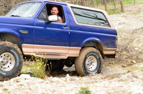 1996 Ford Bronco - This 1996 Ford Bronco navigates a muddy off-road trail, its capabilities.