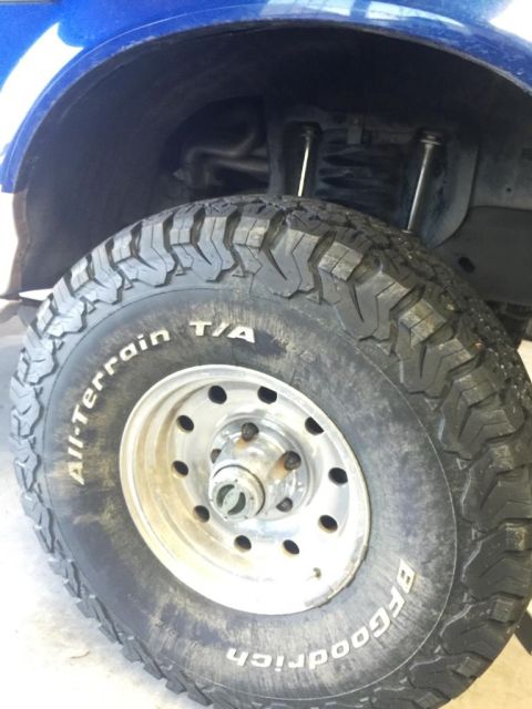 1996 Ford Bronco - Close-up of a tire and suspension components, likely from a truck or SUV.