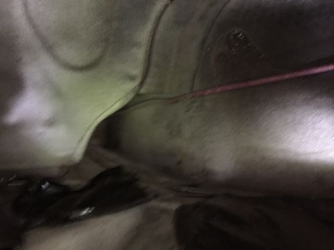 1981 Ford LTD - The car has a convenient factory hole to run wires to the trunk. The factory trunk lighting wires run through here with no grommet so my ba…
