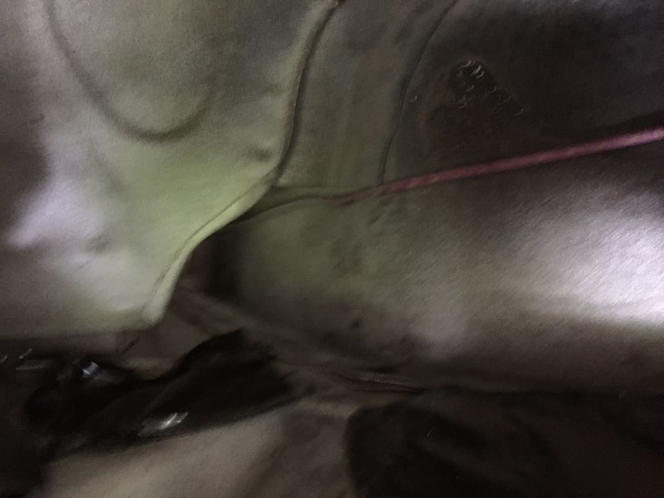 The car has a convenient factory hole to run wires to the trunk. The factory trunk lighting wires run through here with no grommet so my battery cables should be fine in the flexible conduit I'm using.