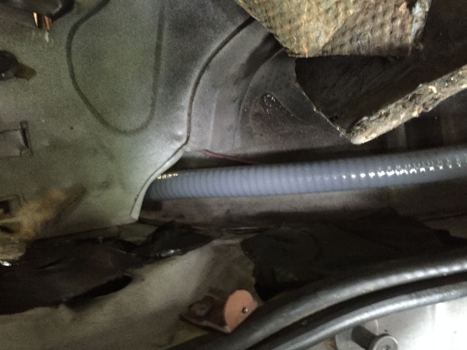 Flexible conduit run. This is all behind the rear seat and behind various panels and whatnot. It's invisible once the interior is in.
