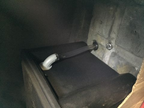 1981 Ford LTD - Battery box vent. Hose plastic epoxied into the 90 degree bulkhead fitting and into the trunk sheet metal.