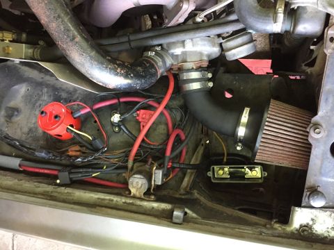 1981 Ford LTD - The former battery location is full of air filter. Running the two cables through the conduit was not easy; it took a lot of lube but it wo…