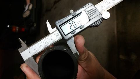 1995 Ford Mustang - A digital caliper measures the outer diameter of a black rubber hose. The caliper reads 20.75 mm.
