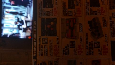 1995 Ford Mustang - This is a photograph of a newspaper advertisement featuring various automotive tools and kits. The advertisement includes items such as a r…