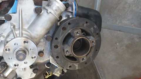 1995 Ford Mustang - A close-up view of a vehicle's engine block, focusing on the water pump and the crankshaft pulley. The engine appears to be a V8, possibly…
