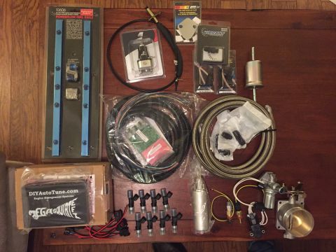 1981 Ford LTD - Big ol pile of fuel injection parts. This isn't all of it either. Takes a bunch of little bits to do things.