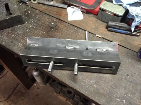 1981 Ford LTD - Made a bracket to hold the intake flat for boring the injector holes. Simple 45 degree plate bolts to the intake flange and bolts to the dr…