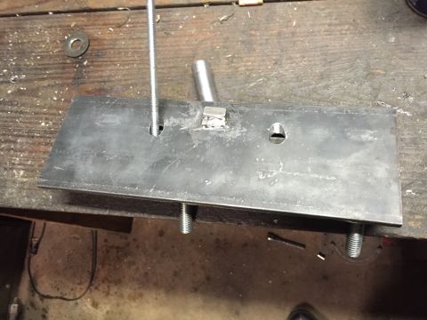 1981 Ford LTD - Welded lug supports the intake port. I bored a hole under this so the bit wouldn't ride down the flange and screw up the hole.
