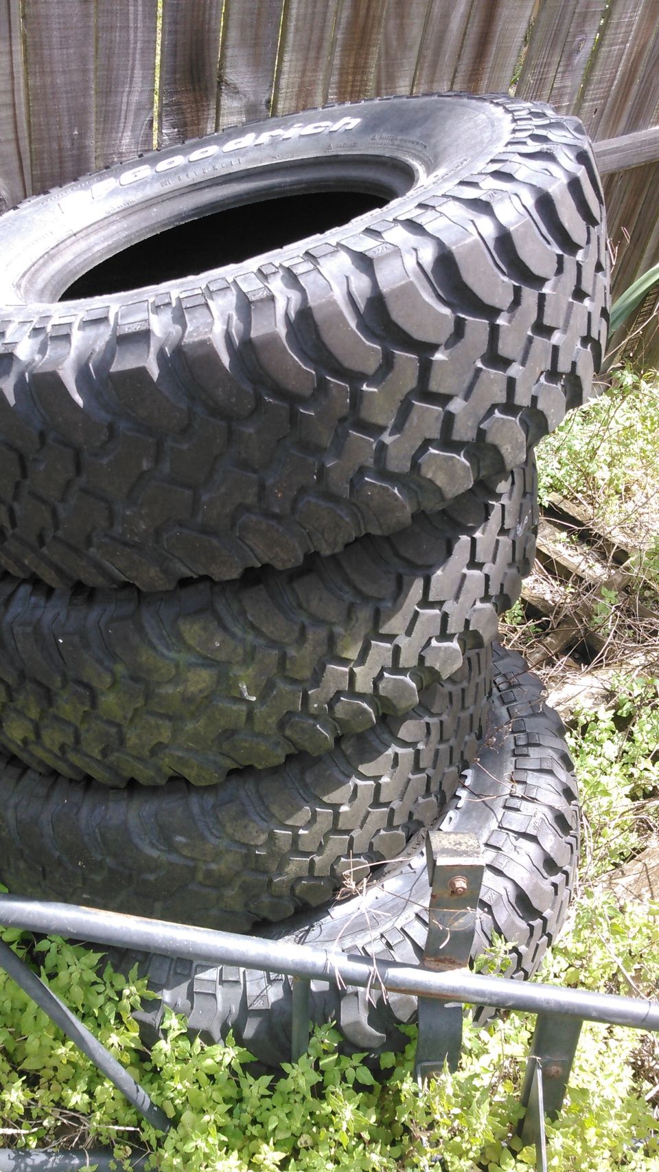 305 75 16 BFG Mud tires. alot of tread but old and dryrotted