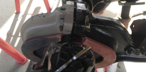 1991 Ford Bronco - A close-up view shows a disassembled differential housing with internal gears and a red gasket. The housing appears to be made of black and…