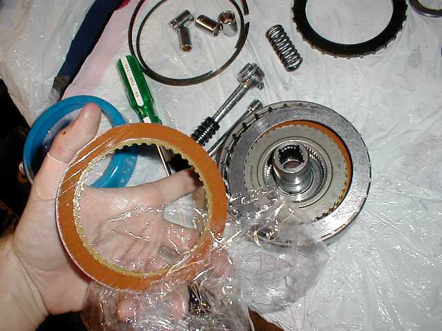 Putting new clutches and steels in the direct clutch drum. Many a people who loose 3rd and 4th wish they could be at this step instantly!