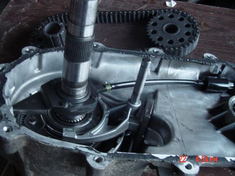 1987 Ford Bronco - Close-up view of the internal components of a transfer case, including a drive chain and gear.