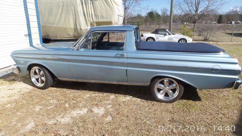 1965 Ford Ranchero - Side view of a light blue 1965 Ford Falcon Ranchero with aftermarket wheels.