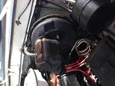 1979 Ford Bronco - Close-up view of engine bay components including the brake booster and master cylinder.