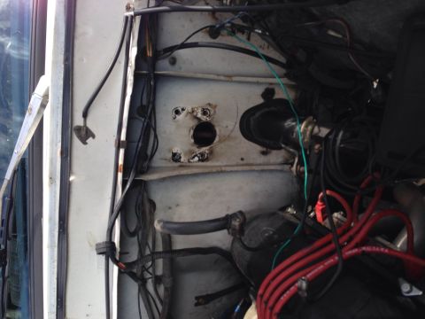1979 Ford Bronco - The engine bay of a vehicle, with a focus on the complex wiring and plumbing. The Supermotors logo is visible.