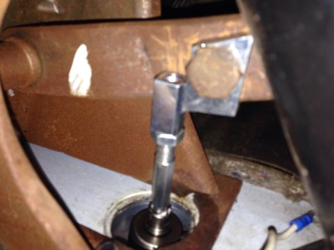 1979 Ford Bronco - Close-up view of a mechanical linkage assembly inside a vehicle's interior.