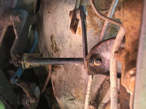 1978 Ford Bronco - This image shows a close-up view of the mechanical linkage for a vehicle's shifter system.
