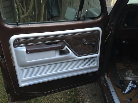 1978 Ford Bronco - Interior door panel of a 1978 Ford Bronco, showing trim details and hardware.