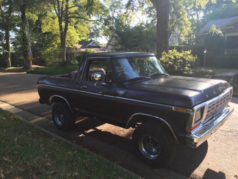 1978 Ford Bronco - This 1978 Ford Bronco is parked on a tree-lined street in front of houses.