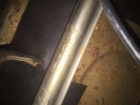 1971 Dodge Dart - Close-up of stamped numbers on a metal component, possibly a VIN or part number, with visible rust.