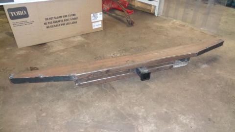 1985 Ford Bronco - A custom-fabricated steel trailer hitch receiver is shown lying on a concrete floor next to a cardboard box. The hitch is constructed from…