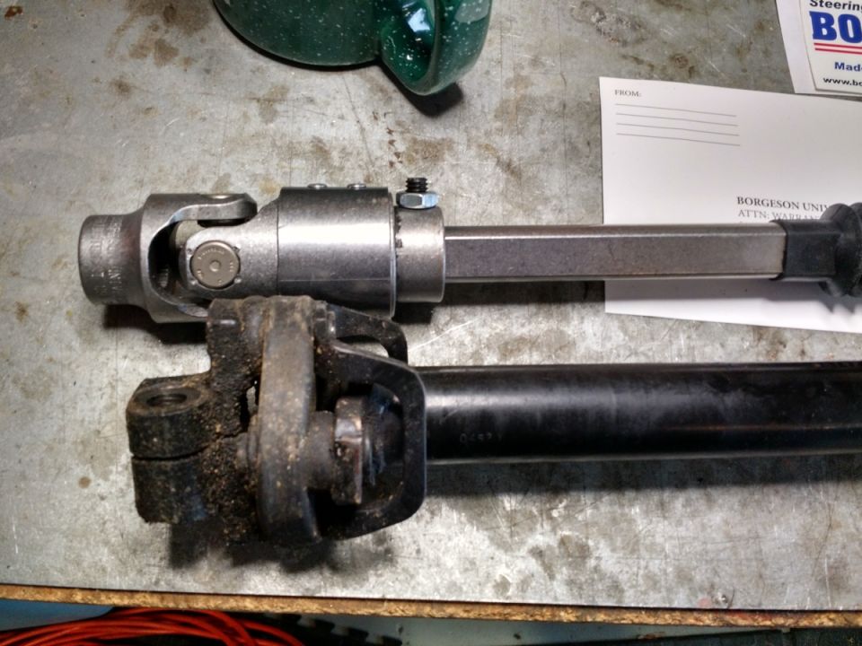 Steering shaft U-joints and shaft segments on a workbench