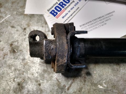1992 Ford Bronco - Close-up view of a Borgeson steering shaft component, with associated paperwork visible in the background.