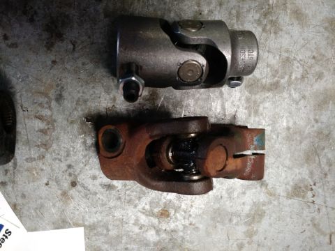 1992 Ford Bronco - Comparison of a new steering universal joint with a heavily rusted one.