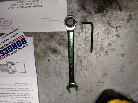 1992 Ford Bronco - Tools and instructions for a Borgeson steering shaft installation are laid out on a workbench.