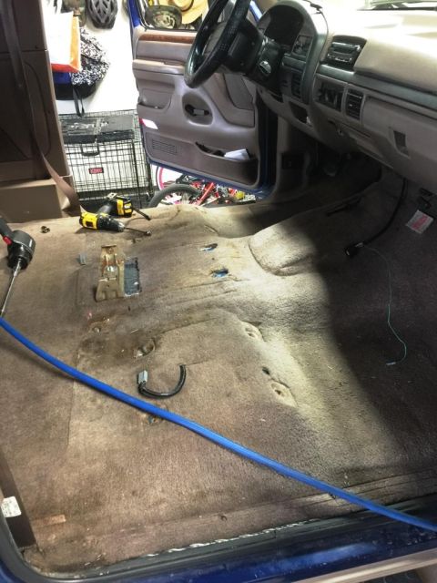 1996 Ford Bronco - The interior of a 1996 Ford Bronco shows the floor with carpet removed and the dashboard.