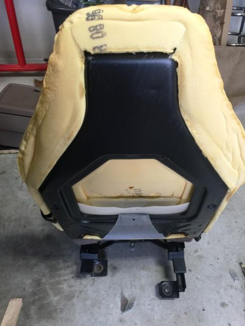 1996 Ford Bronco - Car seat foam and frame assembly, viewed from the underside.