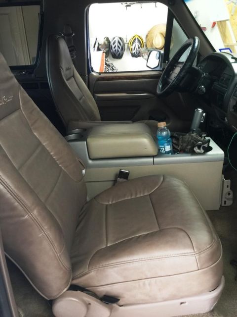 1996 Ford Bronco - Interior view of a 1996 Ford Bronco, showing the front seats and dashboard area.