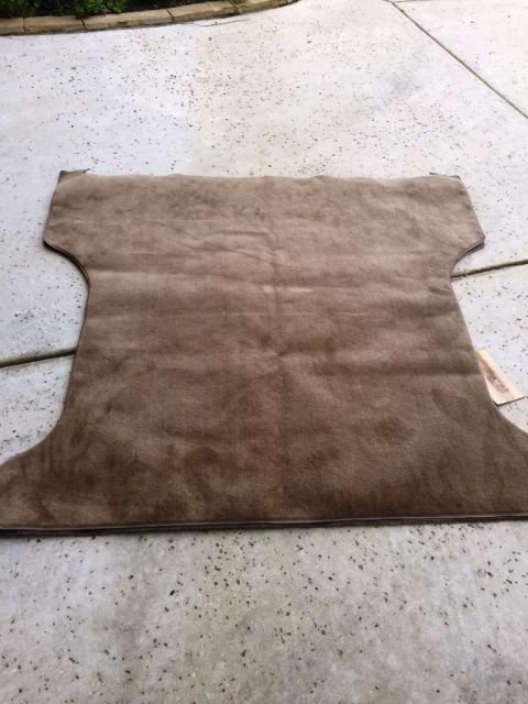 1996 Ford Bronco - Carpet piece shown on concrete surface.