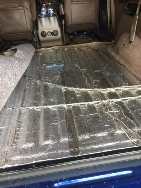 1996 Ford Bronco - Soundproofing material installed on the floor of a vehicle's interior.
