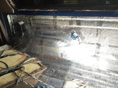 1996 Ford Bronco - Soundproofing material installed on the interior floor and rear panels of a vehicle.