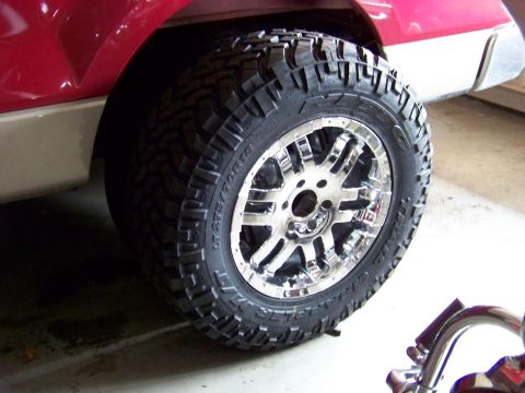 2005 Ford F-150 - Custom chrome wheel and aggressive tire mounted on a truck.