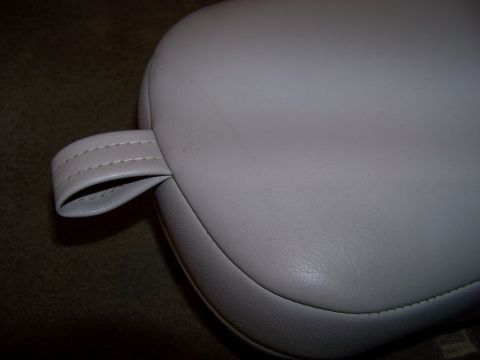 1999 Mercury Grand Marquis - Close-up of a light gray leather armrest a stitched loop detail.