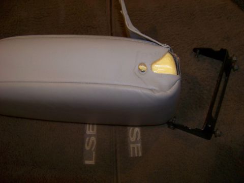 1999 Mercury Grand Marquis - Car armrest and mounting bracket shown. Carpet has 'LSE' and 'SE' lettering visible.