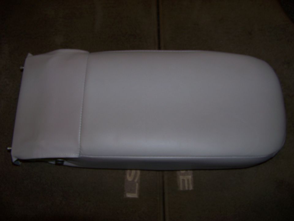 Car armrest, light gray, with stitching detail on the side