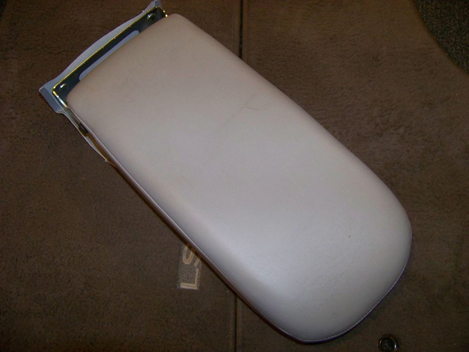 Beige armrest with metal bracket