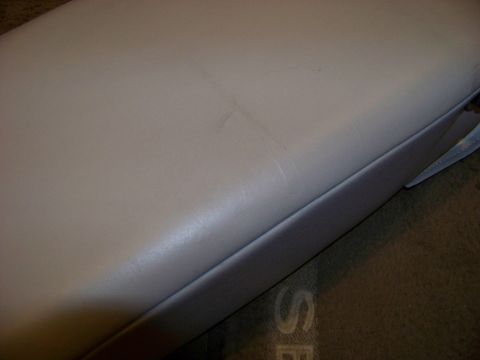 1999 Mercury Grand Marquis - A close-up view of a worn vehicle armrest, showing texture and slight damage. The Supermotors.net logo is visible in the corner.