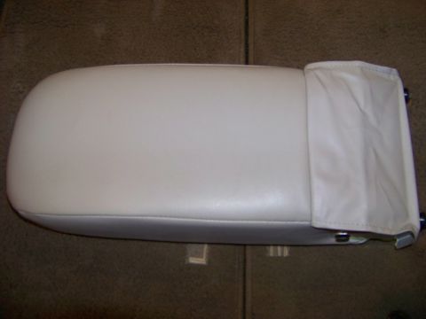 1999 Mercury Grand Marquis - Close-up of a beige armrest, likely from a vehicle interior.