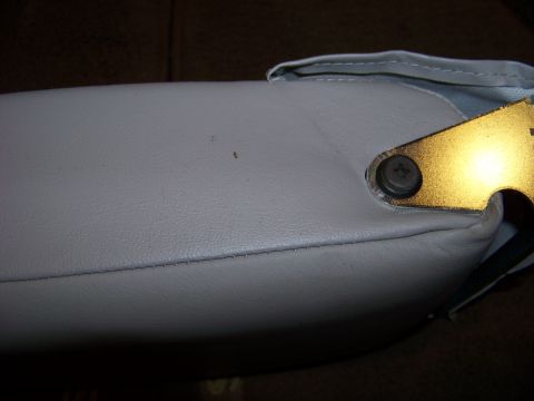 1999 Mercury Grand Marquis - Detail of a car armrest, showing stitching and mounting hardware. Supermotors.net watermark is visible.