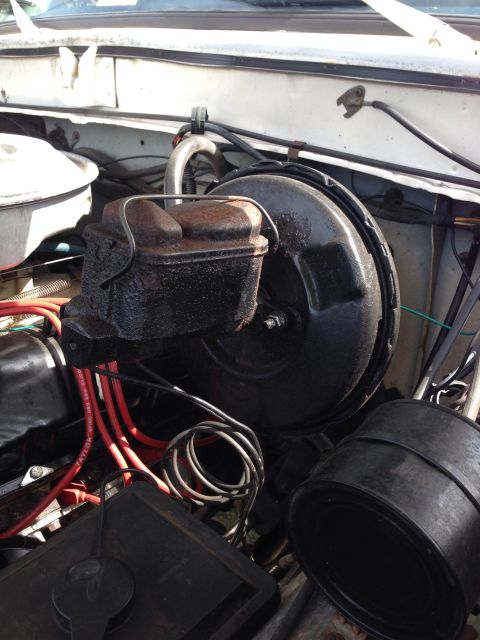 1979 Ford Bronco - Close-up view of engine bay components including the brake booster and master cylinder.