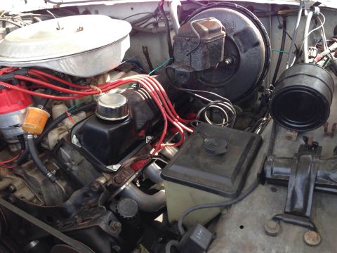 1979 Ford Bronco - Close-up view of engine components including V8 engine, brake booster, and air cleaner assembly.