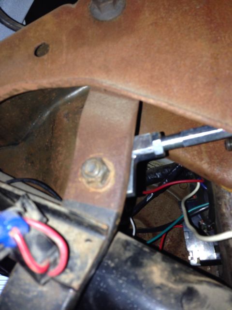1979 Ford Bronco - Wiring and bracketry visible beneath the dashboard of a vehicle.
