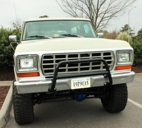 1979 Ford Bronco - Front view of a 1979 Ford Bronco, showing its grille, headlights, and bull bar.