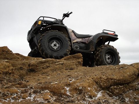 1996 Ford Bronco - ATV parked on a rocky incline under an overcast sky.